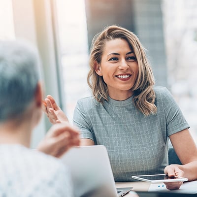 Image of a woman in a business meeting